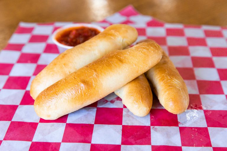 garlic breadsticks with marinara sauce made at topcitygolf
